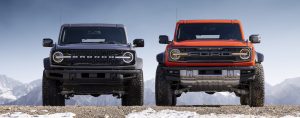 2022 Ford Bronco Raptor and Bronco Wildtrak next to each other comparing size
